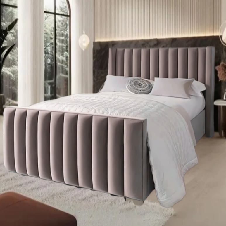 A modern bedroom with a tufted gray velvet Erik Panel bed, white bedding, and a patterned pillow.