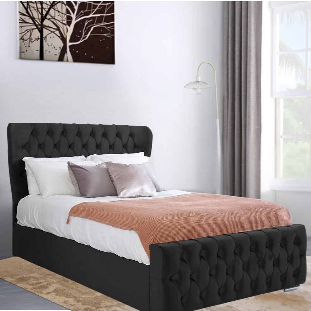 Black tufted EvelynWingbackBed with white bedding, gray pillows, a pink blanket, and wall art of trees.