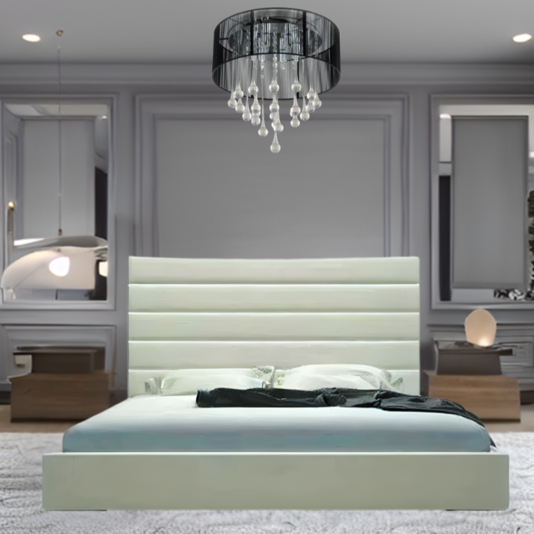 Modern bedroom with a central Leo Panel bed, chandelier, and decorative mirrors.