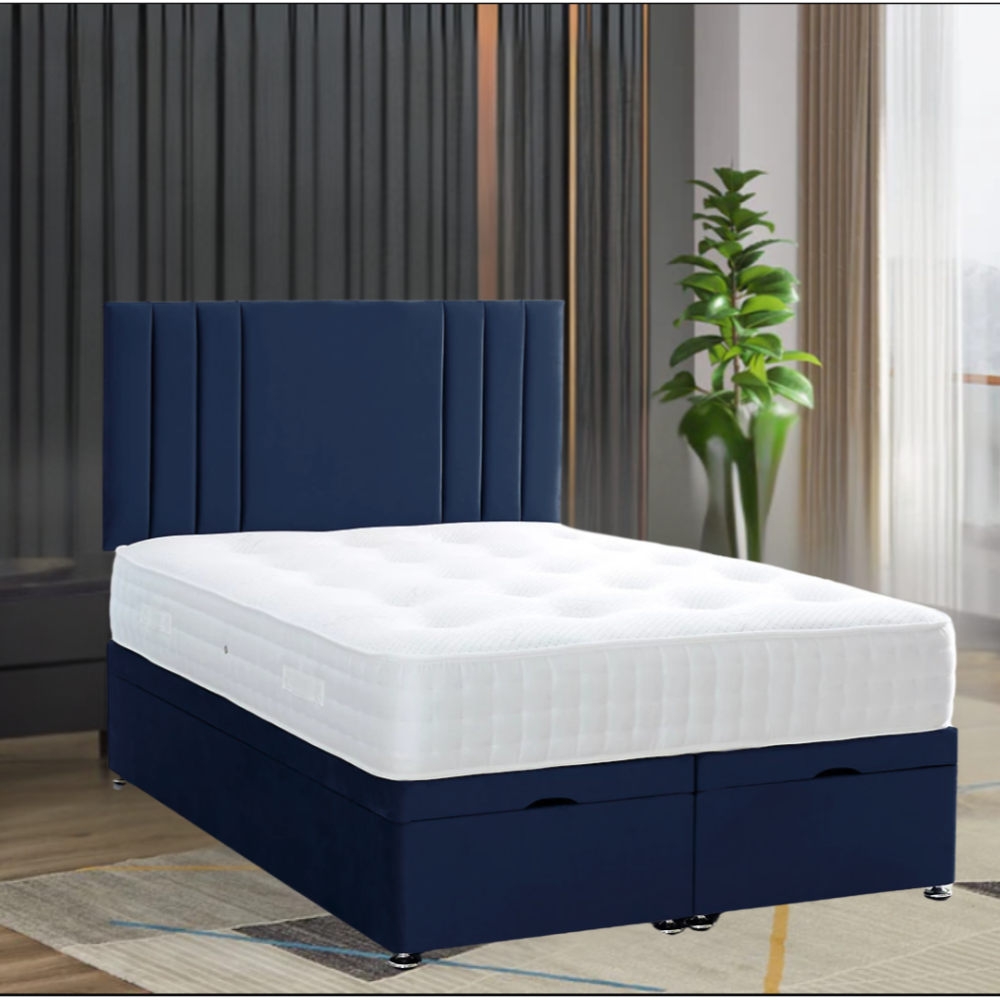 RowanPanelBed with white tufted mattress and deep blue upholstered headboard, featuring a green plant and vertical blinds in the background.