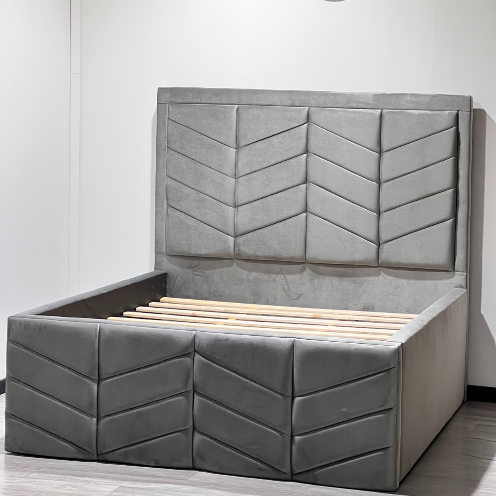 Gray upholstered RyanLuxuryBed with a chevron-patterned headboard and wooden slats.