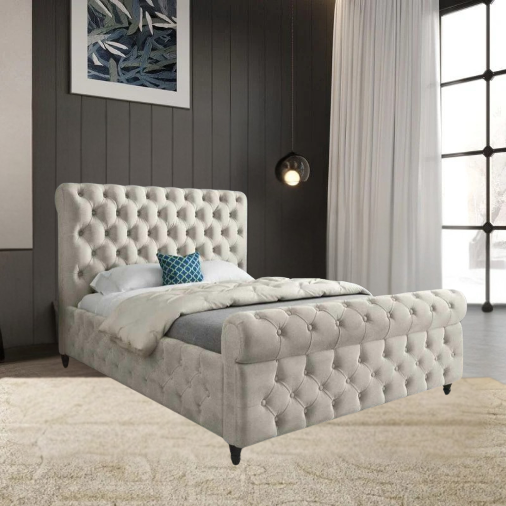 A tufted SwanSleigh bed with a tall headboard and footboard in a modern bedroom with dark wood paneling and a large window.