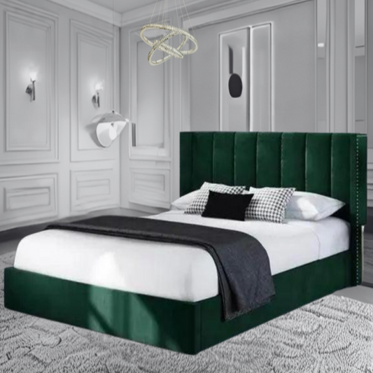 Modern bedroom with an emerald green Emma Paneled Wingback bed, gray walls, and elegant decor.