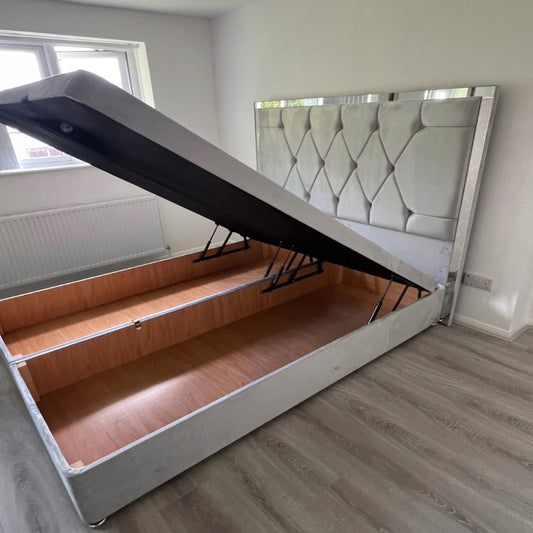 Luke Ottoman Bed - Storage bed with a lifted mattress platform revealing a wooden compartment.
