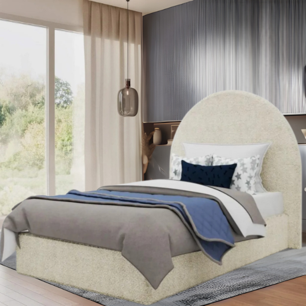 Modern bedroom with a textured Sunny Round Headboard bed, layered bedding, pendant light, and large window.